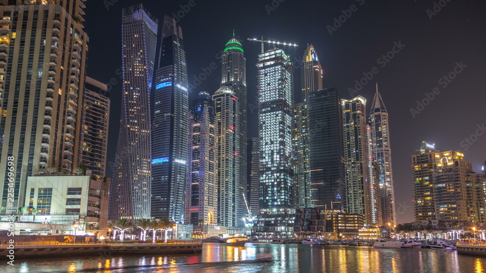 Dubai marina bay with yachts an boats night timelapse Dubai marina bay with yachts an boats night timelapse