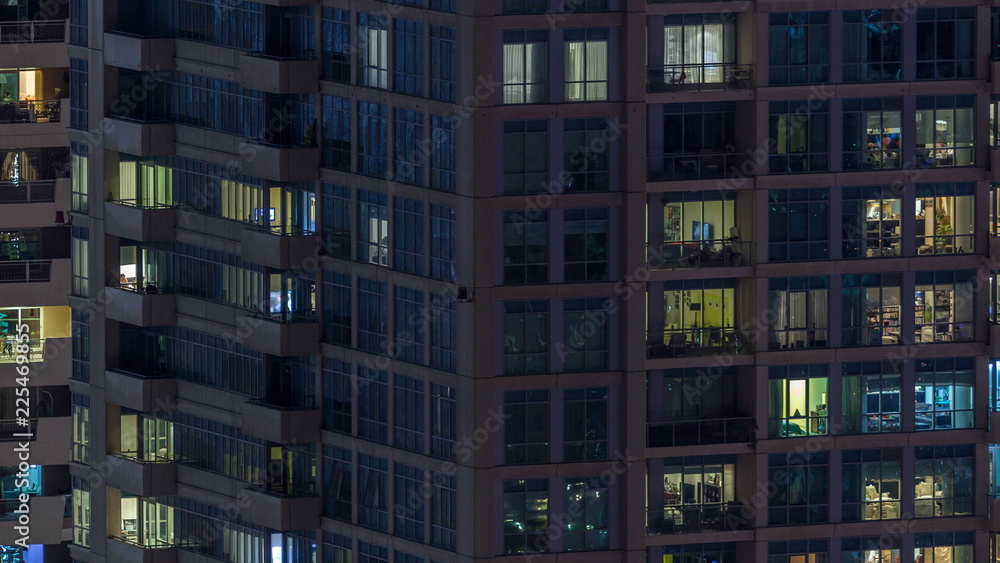 Scenic glowing windows of skyscrapers at evening timelapse