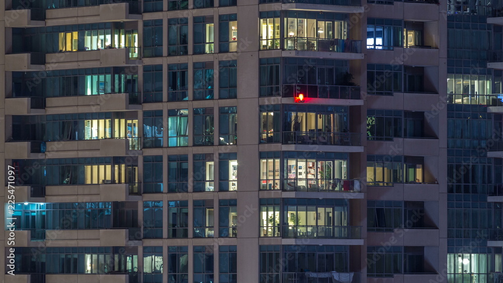 Obraz premium Glowing windows of skyscrapers at evening timelapse