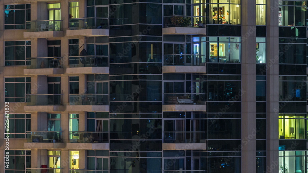 Glowing windows of skyscrapers at evening timelapse Glowing windows of skyscrapers at evening timelapse