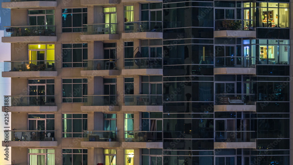 Glowing windows of skyscrapers at evening timelapse Glowing windows of skyscrapers at evening timelapse