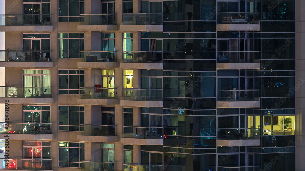 Obraz premium Glowing windows of skyscrapers at evening timelapse