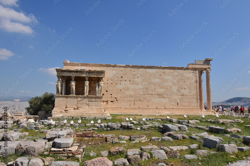 Fototapeta premium Side Facade of the Erechtheion known as The Caryatids At The Acropolis Of Athens. History, Architecture, Travel, Cruises. July 9, 2018. Acropolis Of Athens, Greece.