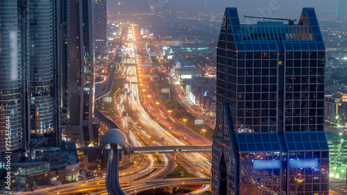 Dubai downtown skyline day to night timelapse and Sheikh Zayed road traffic, UAE