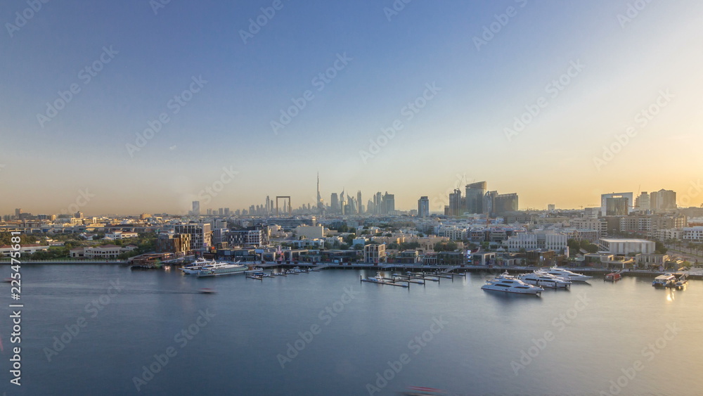 Dubai creek landscape timelapse with boats and ship and modern buildings in the background during sunset