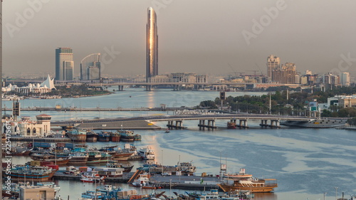 Canvas Print Dubai creek landscape timelapse with boats and ship in port and modern buildings
