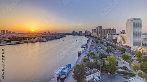 Schilderij op canvas Dubai creek landscape at sunset timelapse with boats and ship near waterfront