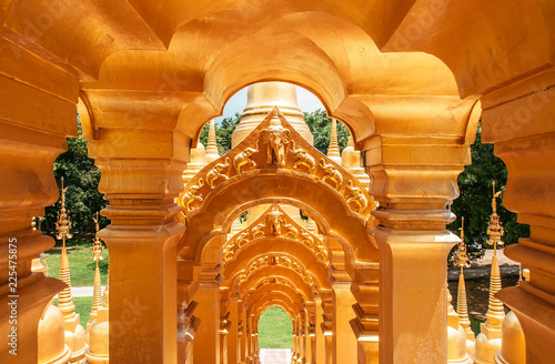 Golden arch gates entrance of Thai pagodas of Wat Pasawangboon, Saraburi photo