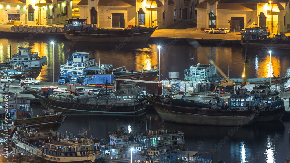 Loading a ship in Port Said night timelapse in Dubai, UAE.