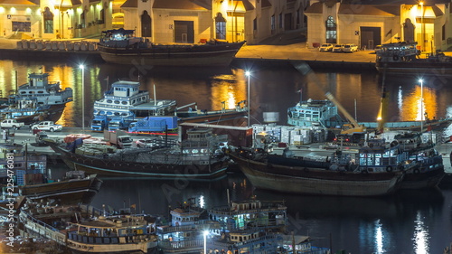 Loading a ship in Port Said night timelapse in Dubai, UAE.