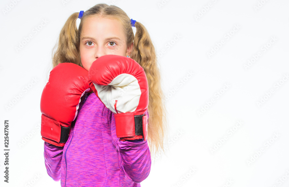 Feminist movement. Self defence concept. Girl boxer knows how defend herself. Girl child strong with boxing gloves posing on white background. She ready to defend herself. Sport upbringing for girls Feminist movement. Self defence concept. Girl boxer knows how defend herself. Girl child strong with boxing gloves posing on white background. She ready to defend herself. Sport upbringing for girls