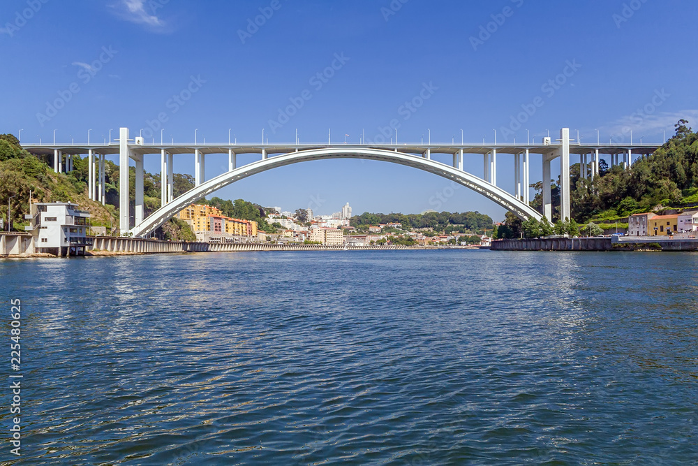 Fototapeta premium Ponte da Arrabida Bridge in Porto or Oporto city, Portugal. Connects the cities of Porto or Oporto and Vila Nova de Gaia over the Douro River