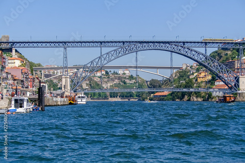 19th century Dom Luis I bridge over Douro River with Porto city (L) and Gaia (R). Infante D. Henrique Bridge in background. Porto, Oporto, Portugal