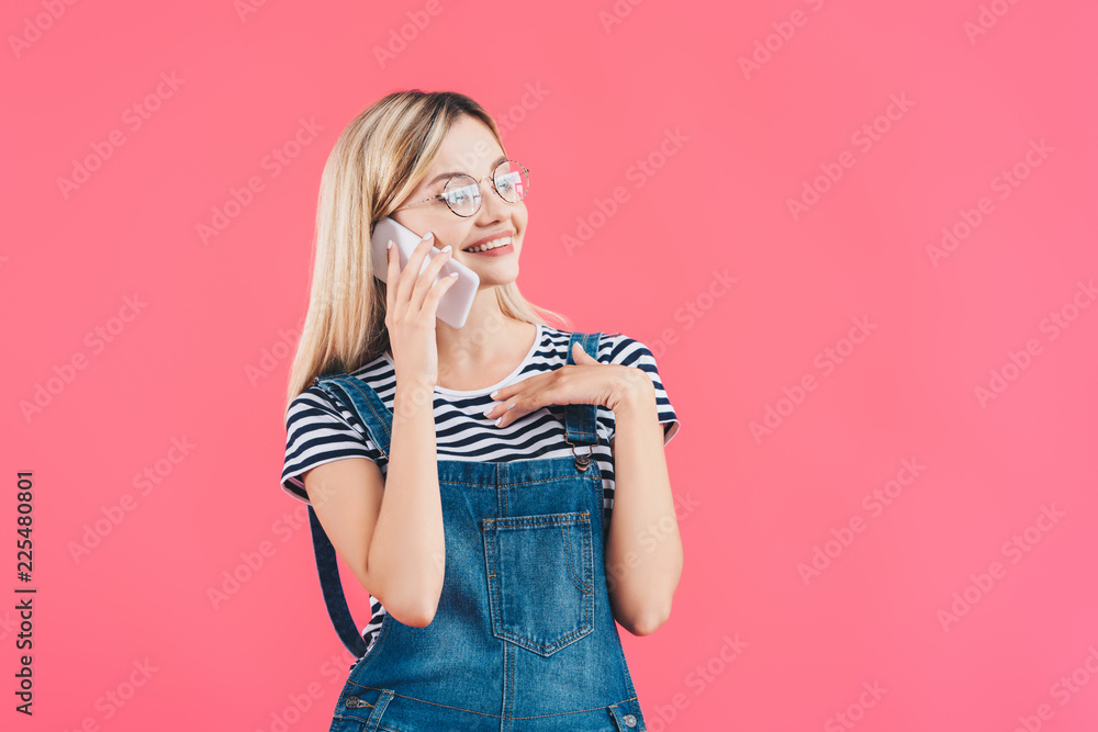 portrait of young smiling woman talking on smartphone isolated on pink portrait of young smiling woman talking on smartphone isolated on pink