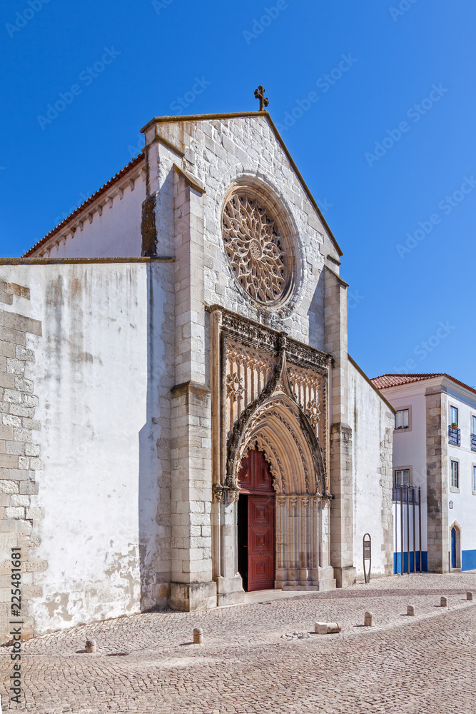 Fototapeta premium Santarem, Portugal. Igreja de Santo Agostinho da Graca church, with largest Rose Window carved of a single slab in Portugal. 14th and 15th century Mendicant and Flamboyant Gothic