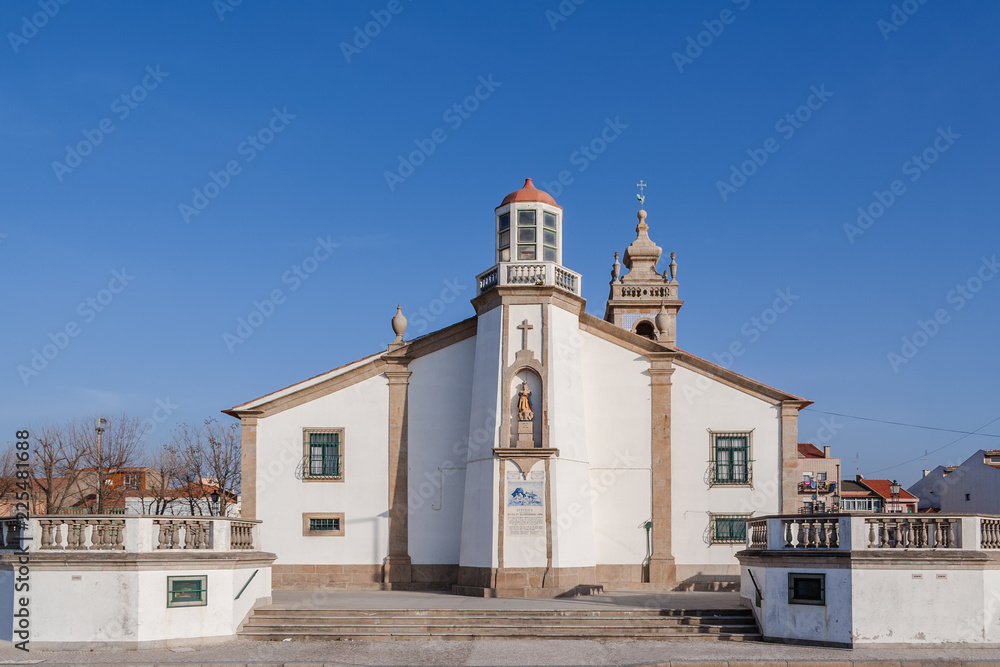 Nossa Senhora da Lapa church with a lighthouse imbedded in Povoa de Varzim, Portugal. Where local fishermen and families seek help in times of danger
