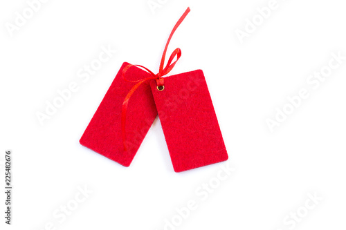 Red sale tags or labels, isolated on white background. Copy space. Close-up.