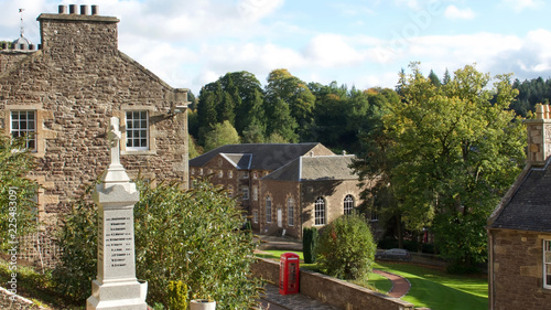 The historic village of New Lanark. A World Heritage Site in a deep valley next to the River Clyde. War memorial. photo