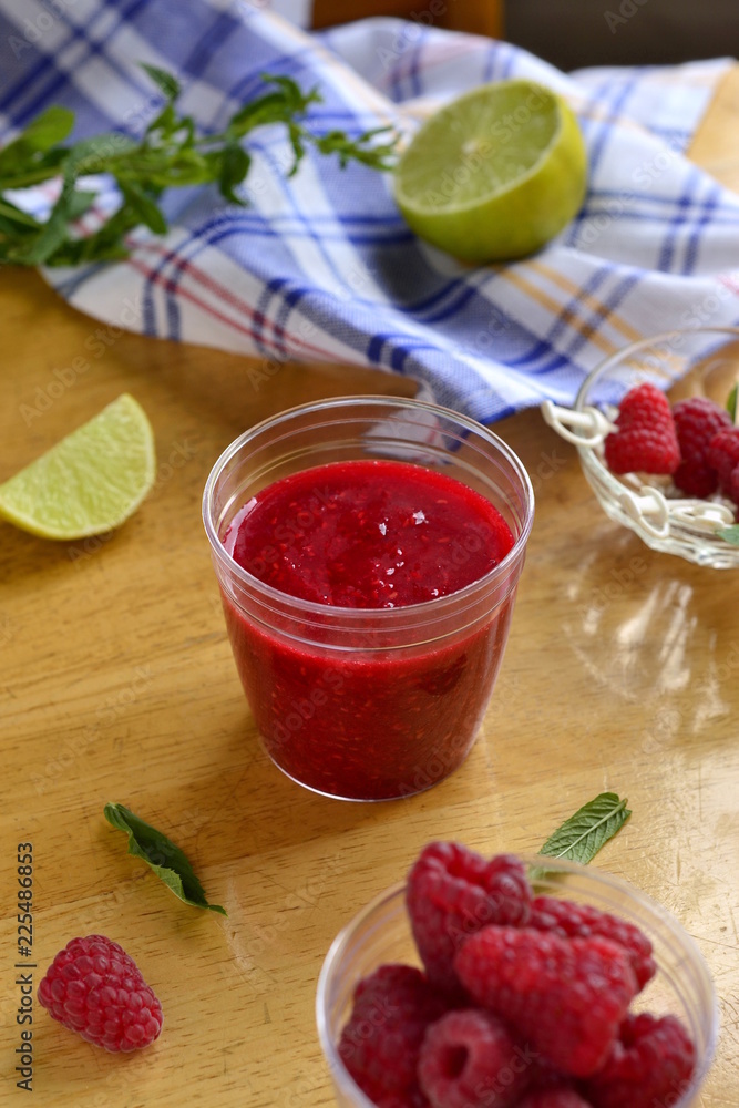 Raspberry smoothies with lime and mint, vertical Raspberry smoothies with lime and mint, vertical