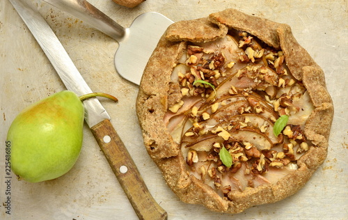 Galeta with pear, cream cheese, walnuts and honey, top view photo