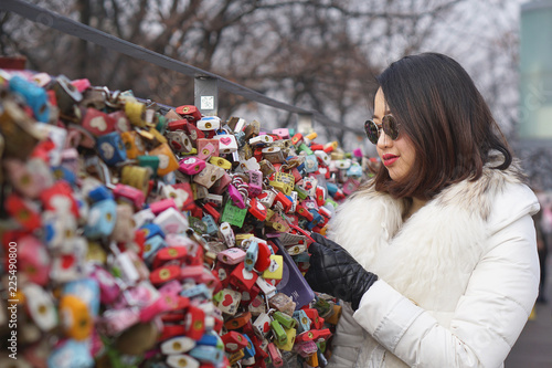 Photography A girl looking to the key of love after locked in place at Namsan Tower