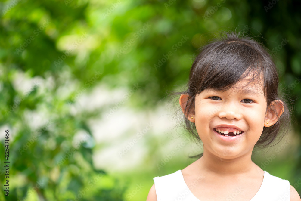Portrait Asian beautiful girl smiling happy in outdoor park. Portrait Asian beautiful girl smiling happy in outdoor park.