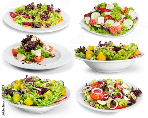 Different kinds of salads on background