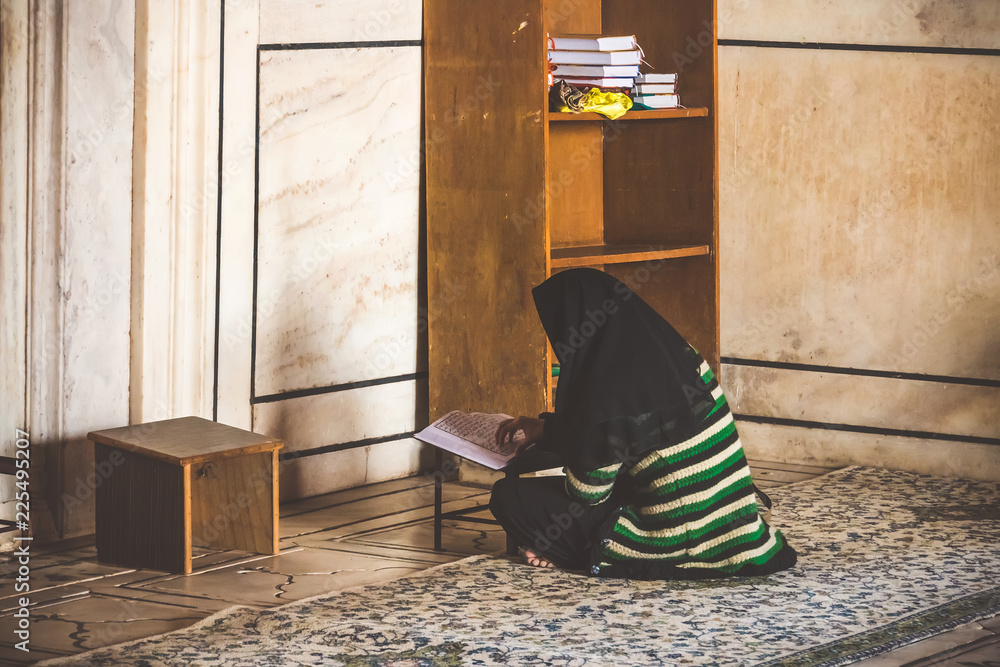Muslim Woman Reading Holy Quran in the Indian mosque. Scripture study ...