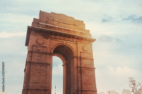Historic India Gate Delhi - A war memorial on Rajpath road New Delhi. main Indian historical landmark in the background of the cloudy sky in the sunlight. photo