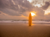surfboard on the beach in sea shore at sunset time with beautiful light