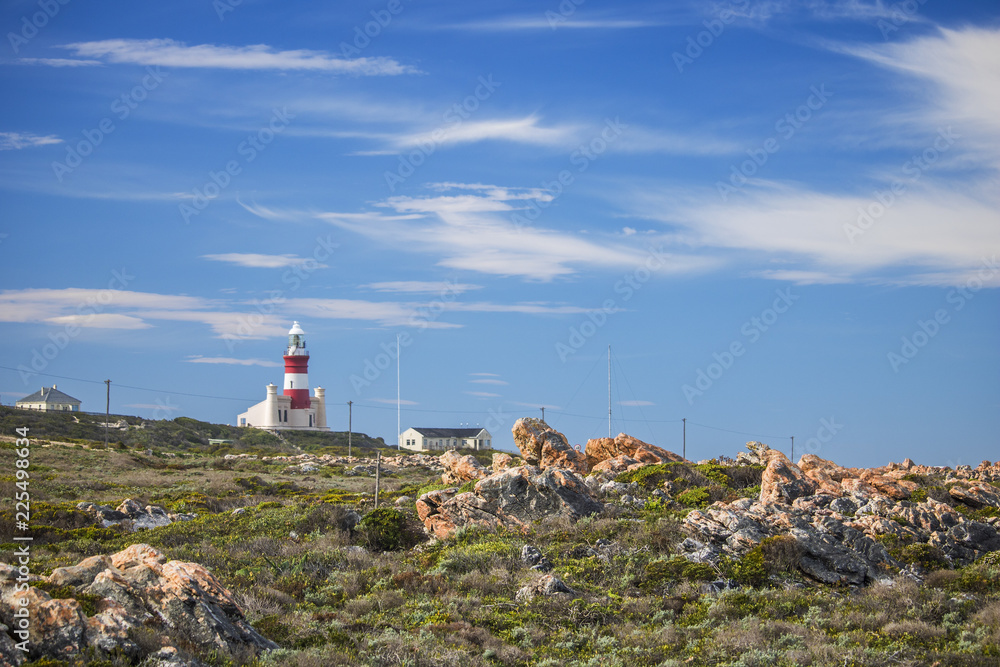 Tourist landmark lighthouse on a hill in the Southern most point of Africa, Cape Agulhas.