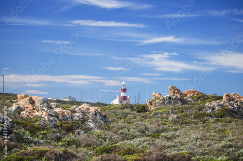 Tourist landmark lighthouse on a hill in the Southern most point of Africa, Cape Agulhas.