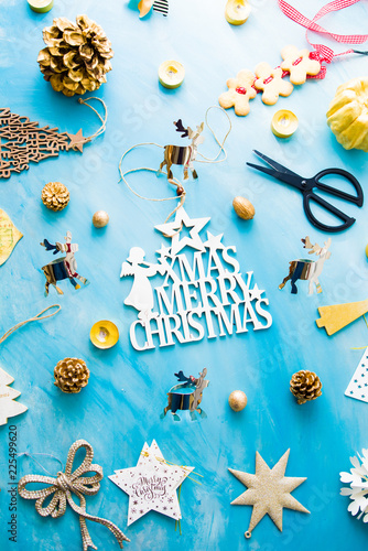 Christmas concept background with decorations  needed to celebrate christmas over a blue azul background