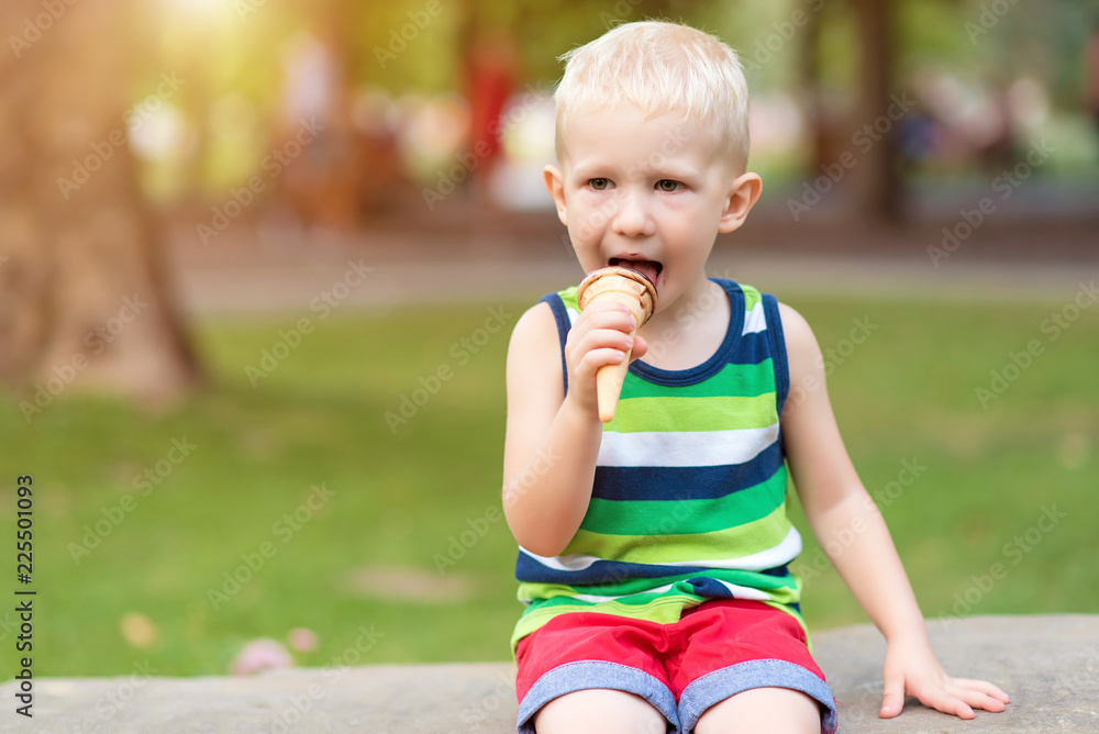 Adorable little boy eating ice cream Adorable little boy eating ice cream