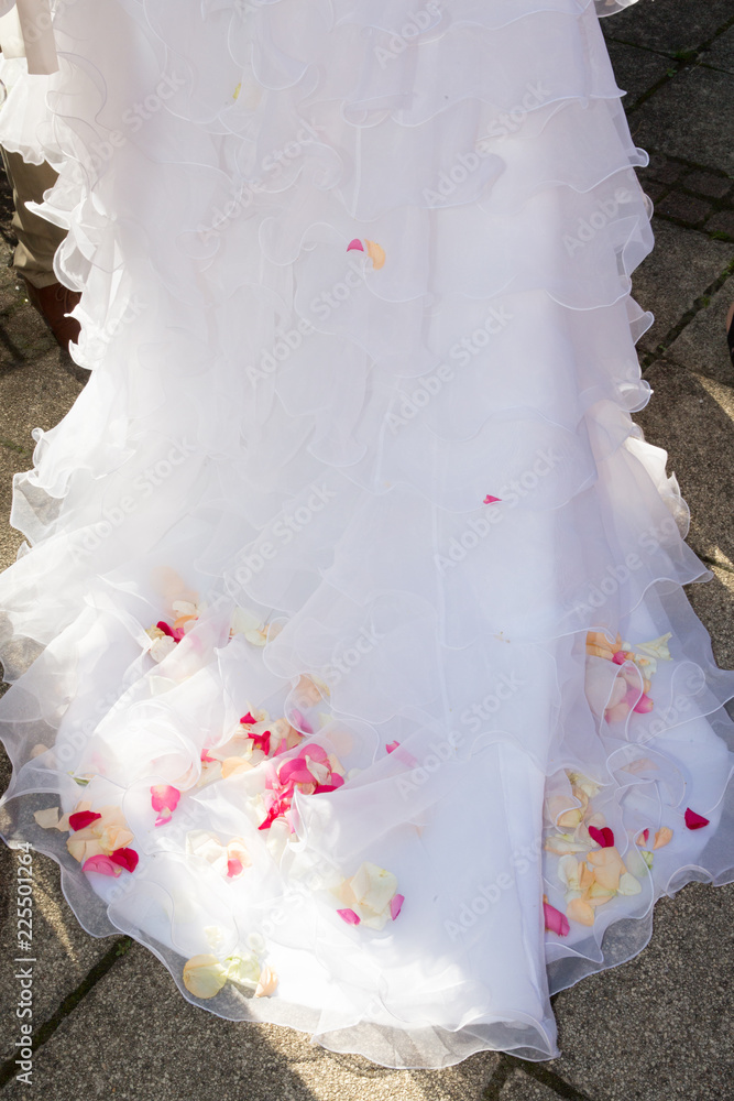 back view of bride wedding dress with pink rose flowers petals back view of bride wedding dress with pink rose flowers petals