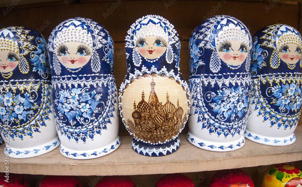 Matryoshkas with miniature painting (nested doll) at the flea market Izmailovo. Moscow, Russia. March, 2017