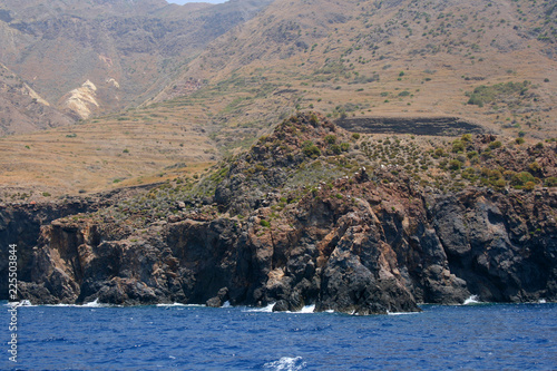 Rocky formation and surf on the Lipary island, Sicilia, Italy. photo