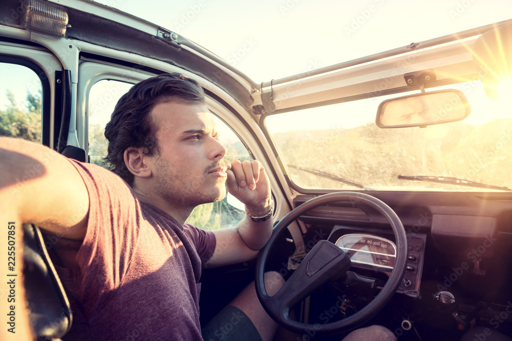 Young man in a car Young man in a car