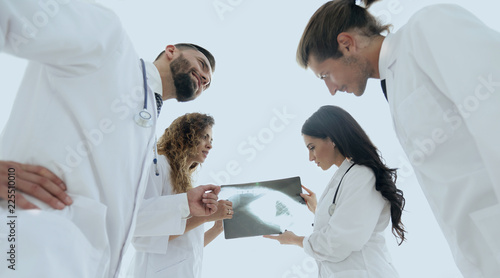 group of doctors discussing an x-ray