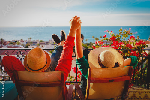 happy couple relax on balcony terrace, honeymoon