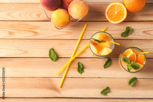 Fresh summer cocktail in glasses on wooden table