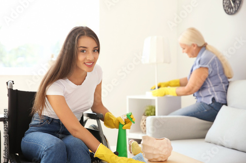 Young woman in wheelchair a...