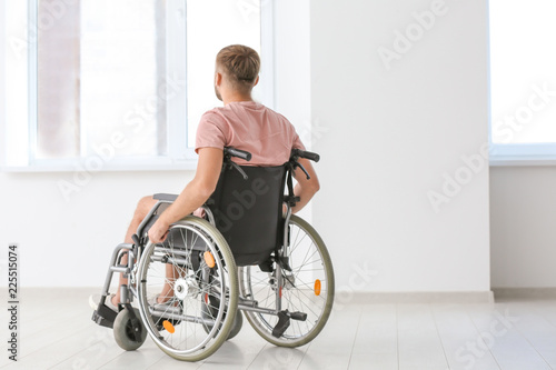 Young invalid man in empty ...