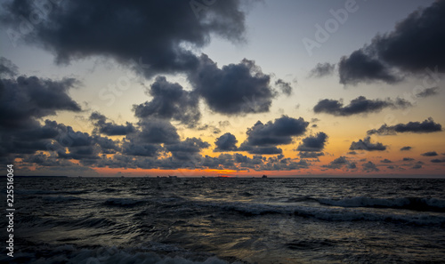 Fototapeta Naklejka Na Ścianę i Meble -  sunset among clouds and waves on the Baltic Sea beach