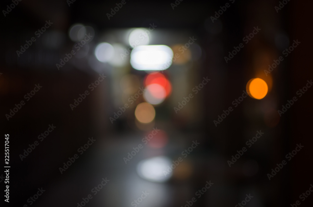 Abstract city night defocused light, blur bokeh, colorful & dark background. Pattern, urban, artistic & backdrop.