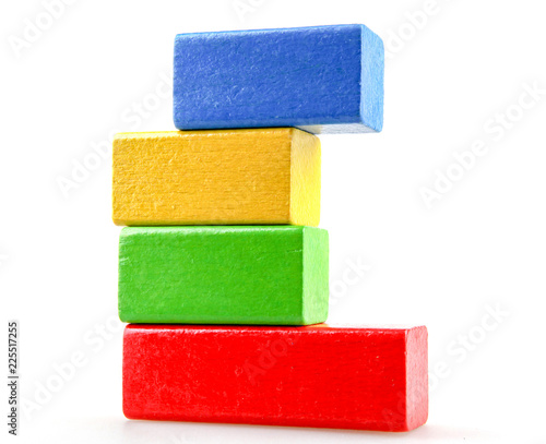 Wooden building blocks isolated on white background.