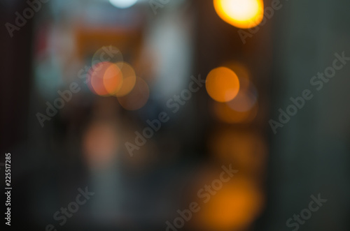 Abstract city night defocused light  blur bokeh  colorful   dark background. Dreamy  street  bubble   backdrop.