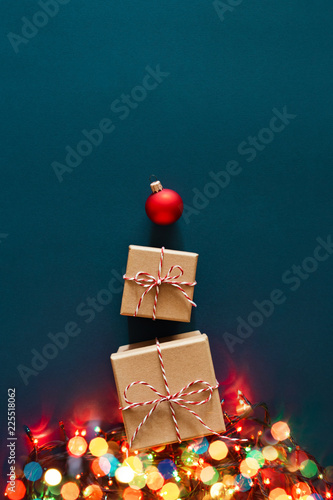 Gift boxes wrapped in kraft paper and tied with candy cane Christmas rope and...