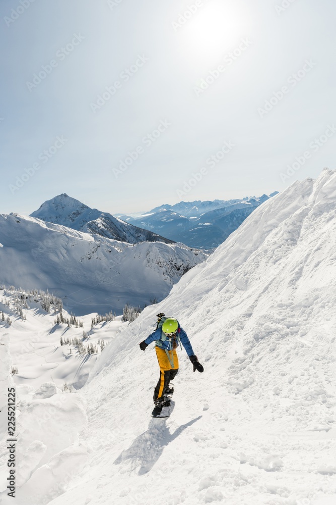 Skier skiing on a snowy mountain Skier skiing on a snowy mountain