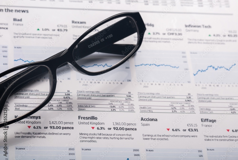 Glasses On Financial Report Close-up Glasses On Financial Report Close-up